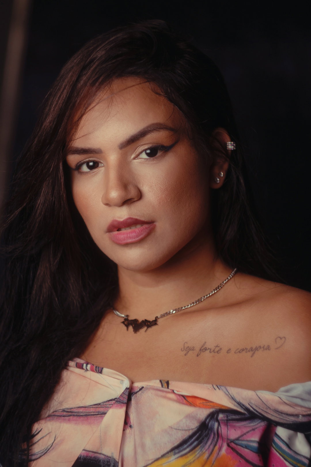 a woman with a tattoo on her chest
